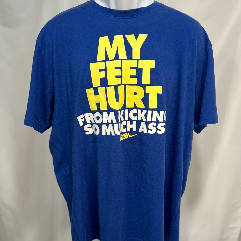 Gently used NIKE DRI-FIT tee shirt in royal blue with yellow writing size XL